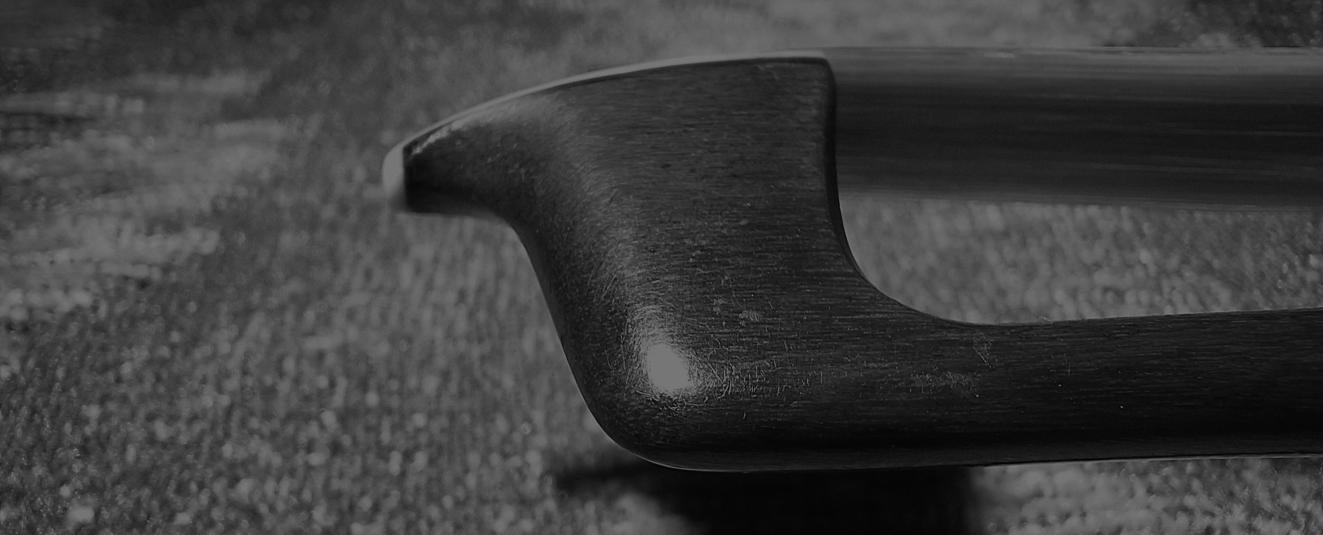 Detail of a violin bow frog
